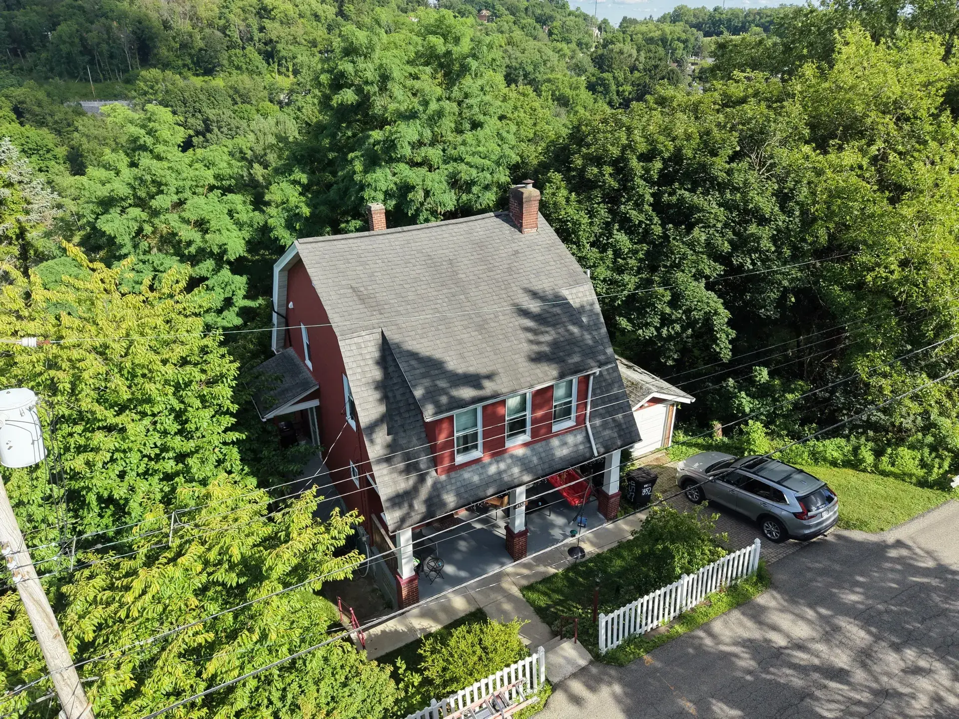 Standing-seam metal roofing panels installed on a residential home — photo 6