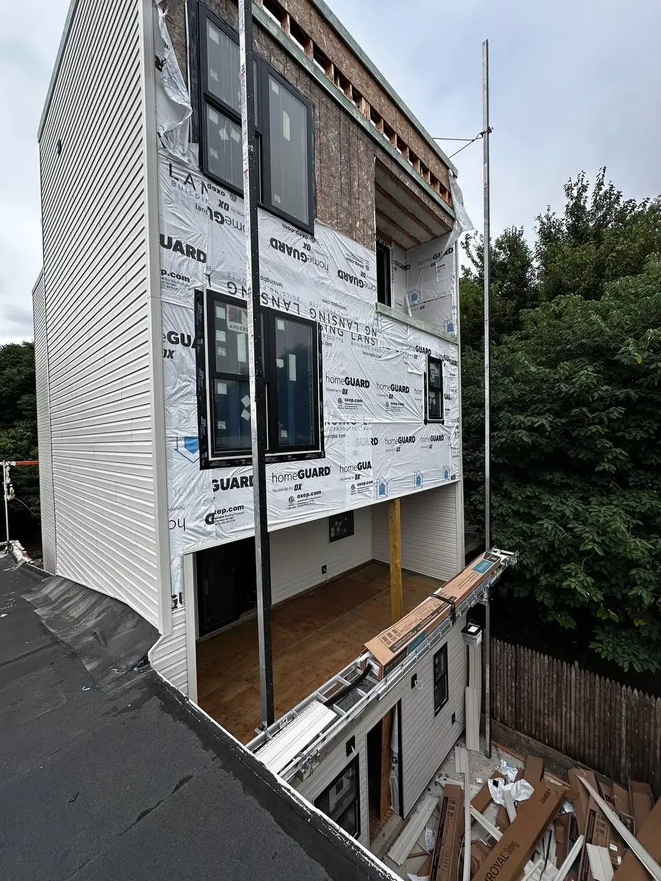 Newly installed soffit and fascia trim along a roofline — photo 2