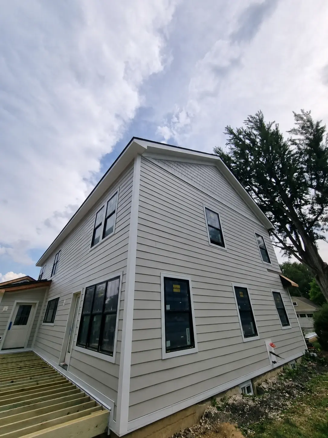 Full tear-off siding replacement in progress on a residential home