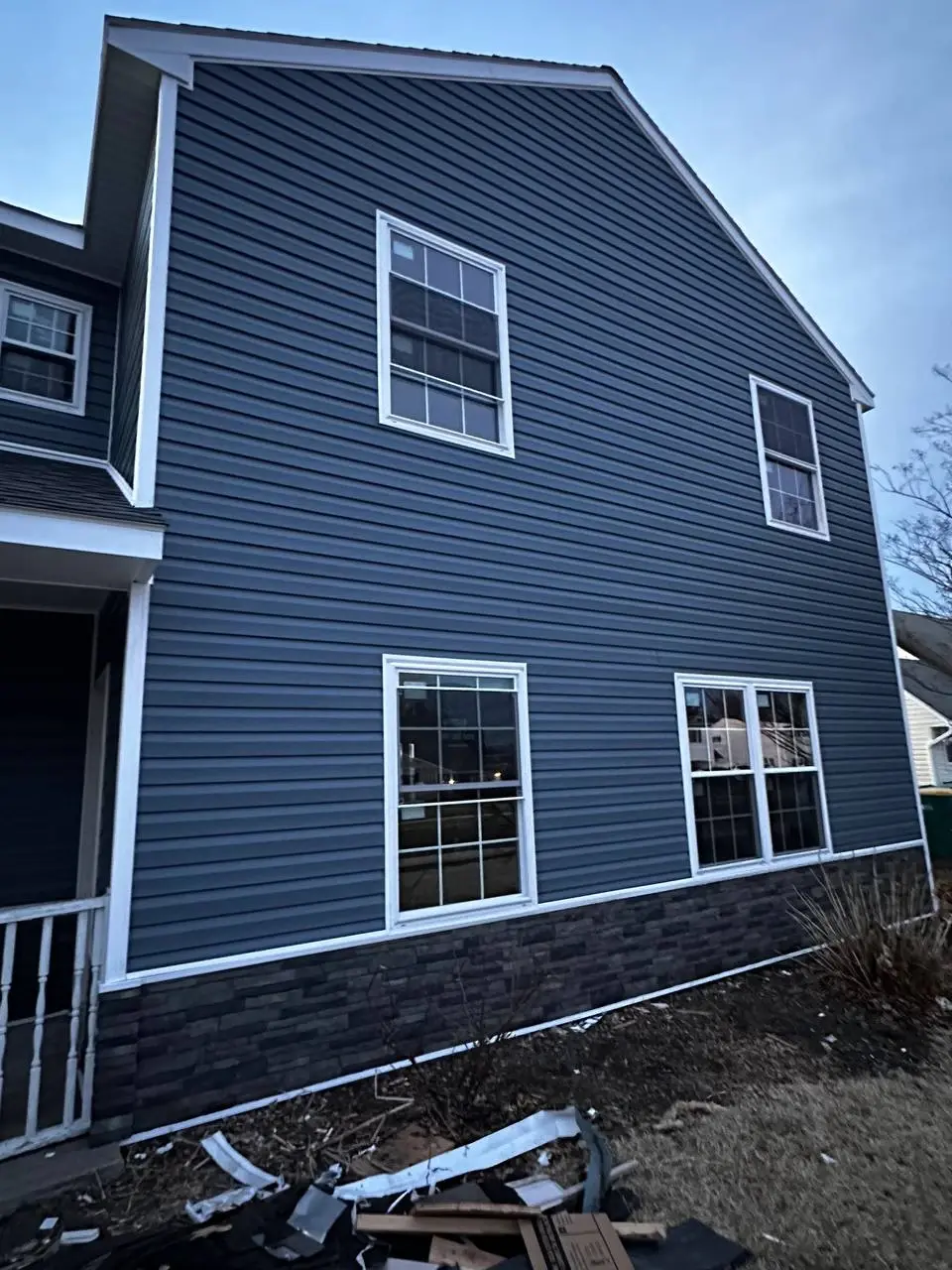 Repair of storm-damaged siding panels on a home exterior — photo 2